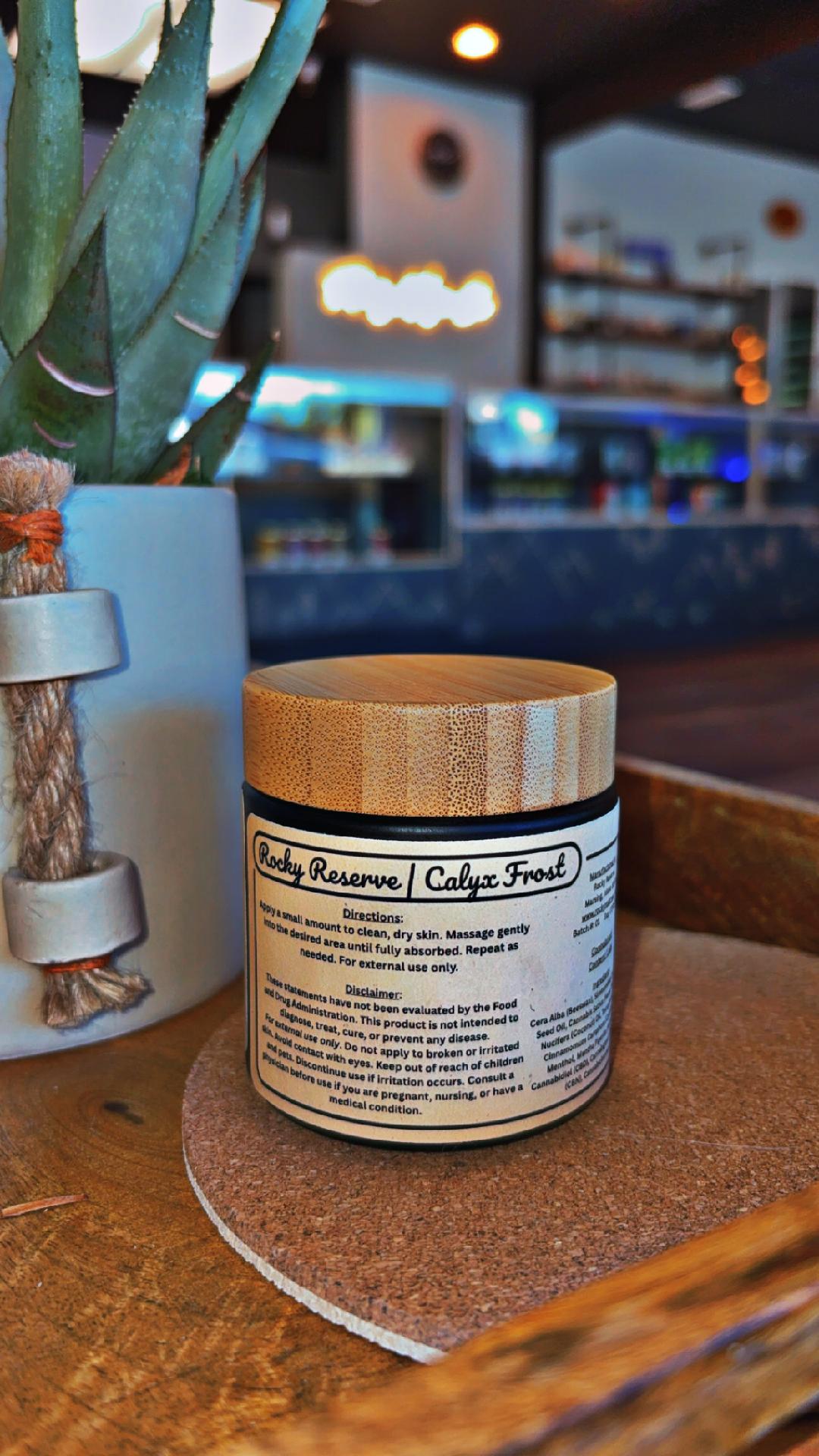 Jar with a label on a wooden surface in a blurred indoor setting