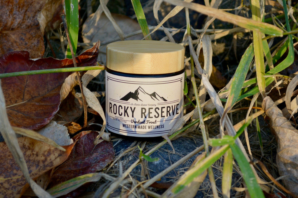 Jar labeled 'Rocky Reserve' on a natural background with grass and leaves.